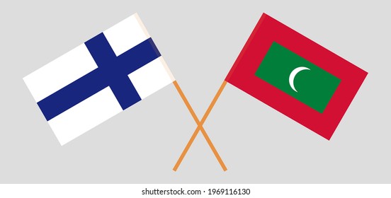 Crossed flags of Finland and Maldives. Official colors. Correct proportion