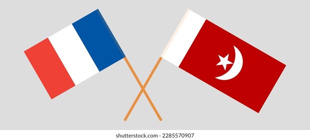 Crossed flags of France and The Emirate of Umm Al Quwain. Official colors. Correct proportion. Vector illustration