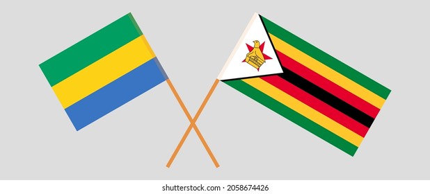 Crossed flags of Gabon and the Republic of Zimbabwe. Official colors. Correct proportion