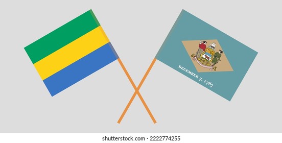 Überquerte Flaggen Gabuns und des Bundesstaates Delaware. Offizielle Farben. Richtiger Anteil. Vektorgrafik
