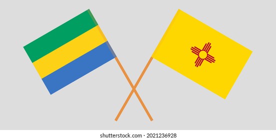 Crossed flags of Gabon and the State of New Mexico. Official colors. Correct proportion