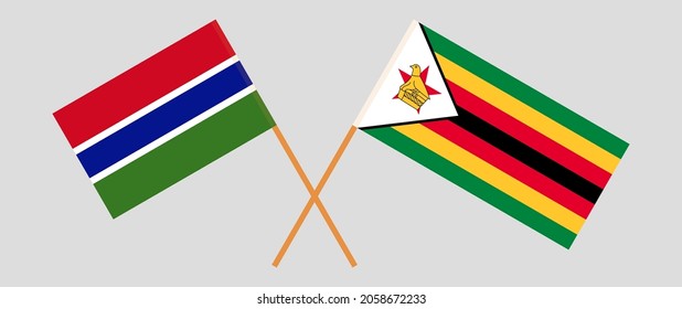 Crossed flags of the Gambia and the Republic of Zimbabwe. Official colors. Correct proportion