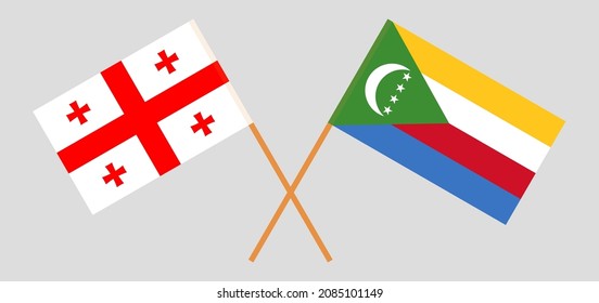 Crossed flags of Georgia and the Comoros. Official colors. Correct proportion. Vector illustration
