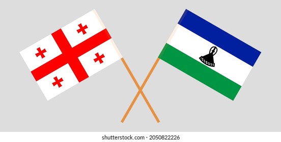 Crossed flags of Georgia and the Kingdom of Lesotho. Official colors. Correct proportion