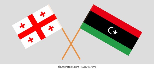 Crossed flags of Georgia and Libya. Official colors. Correct proportion