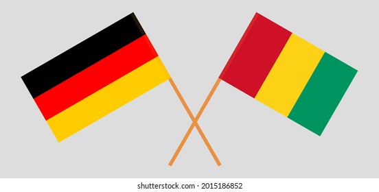 Gekreuzte Flaggen von Deutschland und Guinea. Offizielle Farben. Richtiger Anteil