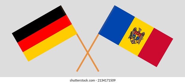 Gekreuzte Flaggen von Deutschland und Moldawien. Offizielle Farben. Richtiger Anteil. Vektorgrafik

