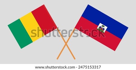 Crossed flags of Guinea and Haiti. Official colors. Correct proportion. Vector illustration
