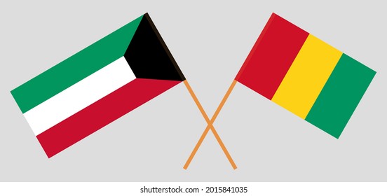 Crossed flags of Guinea and Kuwait. Official colors. Correct proportion