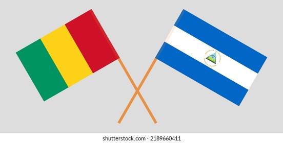 Crossed flags of Guinea and Nicaragua. Official colors. Correct proportion. Vector illustration
