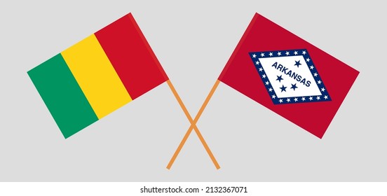 Crossed flags of Guinea and The State of Arkansas. Official colors. Correct proportion. Vector illustration
