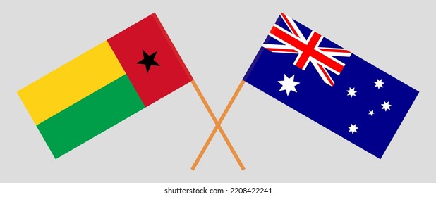 Crossed flags of Guinea-Bissau and Australia. Official colors. Correct proportion. Vector illustration
