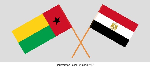 Crossed flags of Guinea-Bissau and Egypt. Official colors. Correct proportion. Vector illustration
