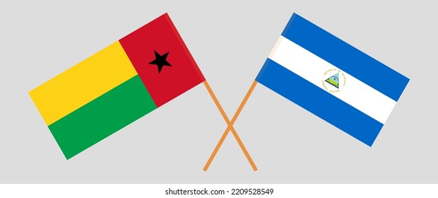 Crossed flags of Guinea-Bissau and Nicaragua. Official colors. Correct proportion. Vector illustration
