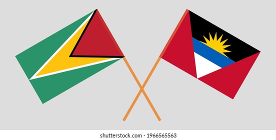 Crossed flags of Guyana and Antigua and Barbuda. Official colors. Correct proportion. Vector illustration