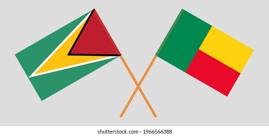 Crossed flags of Guyana and Benin. Official colors. Correct proportion. Vector illustration