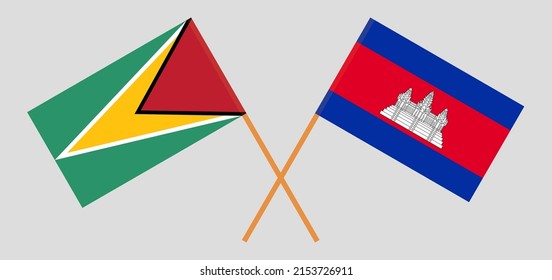 Crossed flags of Guyana and Cambodia. Official colors. Correct proportion