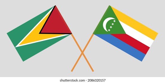 Crossed flags of Guyana and the Comoros. Official colors. Correct proportion. Vector illustration
