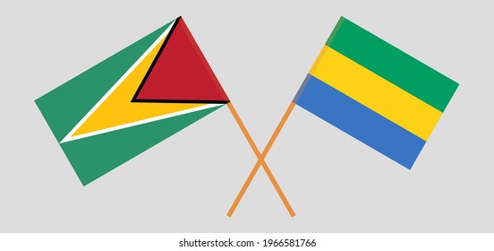 Crossed flags of Guyana and Gabon. Official colors. Correct proportion