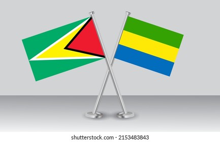 Crossed flags of Guyana and Gabon. Official colors. Correct proportion. Banner design