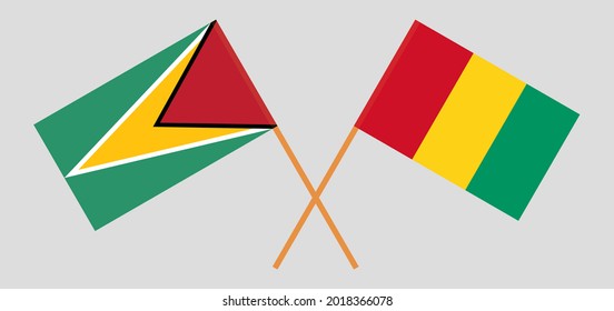 Crossed flags of Guyana and Guinea. Official colors. Correct proportion