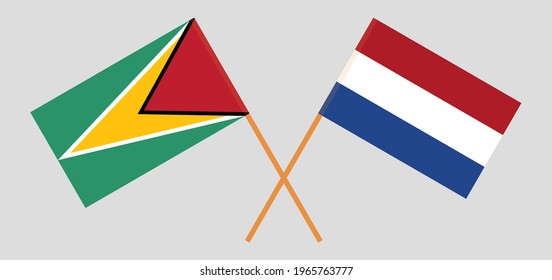 Crossed flags of Guyana and the Netherlands. Official colors. Correct proportion