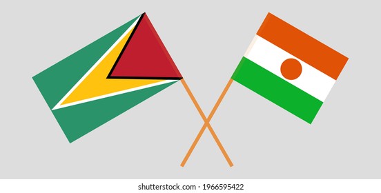 Crossed flags of Guyana and the Niger. Official colors. Correct proportion