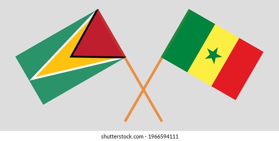 Gekreuzte Flaggen von Guyana und Senegal. Offizielle Farben. Richtiger Anteil
