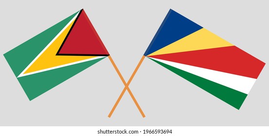 Crossed flags of Guyana and Seychelles. Official colors. Correct proportion