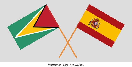 Crossed flags of Guyana and Spain. Official colors. Correct proportion
