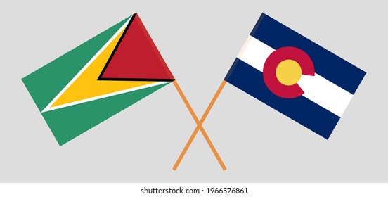 Crossed flags of Guyana and The State of Colorado. Official colors. Correct proportion