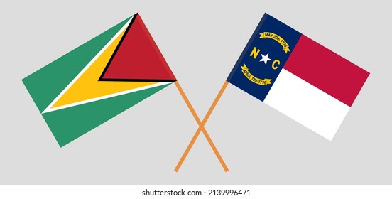 Crossed flags of Guyana and The State of North Carolina. Official colors. Correct proportion. Vector illustration
