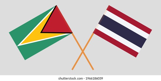 Crossed flags of Guyana and Thailand. Official colors. Correct proportion