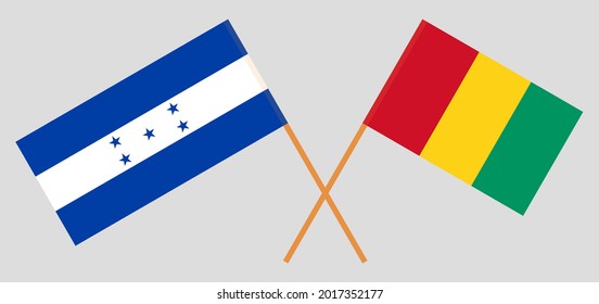 Banderas cruzadas de Honduras y Guinea. Colores oficiales. Proporción correcta