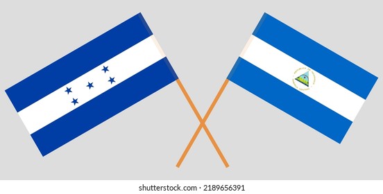 Crossed flags of Honduras and Nicaragua. Official colors. Correct proportion. Vector illustration
