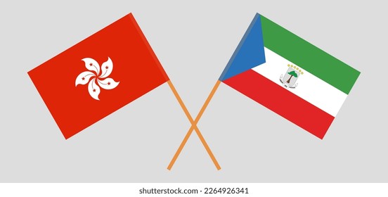 Crossed flags of Hong Kong and Equatorial Guinea. Official colors. Correct proportion. Vector illustration
