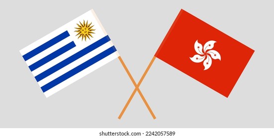 Crossed flags of Hong Kong and Uruguay. Official colors. Correct proportion. Vector illustration
