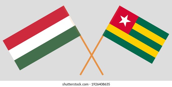 Crossed flags of Hungary and Togo. Official colors. Correct proportion
