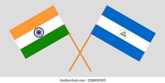 Crossed flags of India and Nicaragua. Official colors. Correct proportion. Vector illustration
