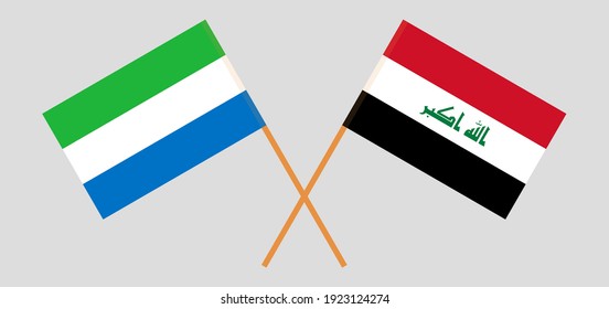 Crossed flags of Iraq and Sierra Leone. Official colors. Correct proportion
