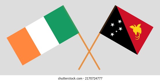Crossed flags of Ireland and Papua New Guinea. Official colors. Correct proportion. Vector illustration
