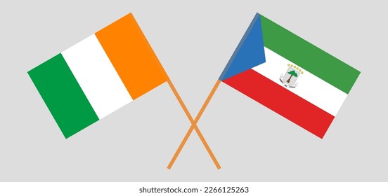 Crossed flags of Ivory Coast and Equatorial Guinea. Official colors. Correct proportion. Vector illustration
