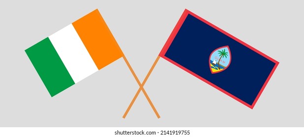 Crossed flags of Ivory Coast and Guam. Official colors. Correct proportion. Vector illustration
