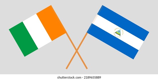 Crossed flags of Ivory Coast and Nicaragua. Official colors. Correct proportion. Vector illustration

