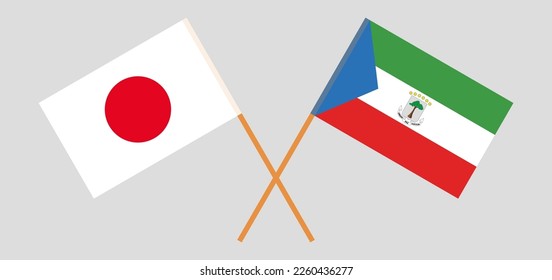 Crossed flags of Japan and Equatorial Guinea. Official colors. Correct proportion. Vector illustration
