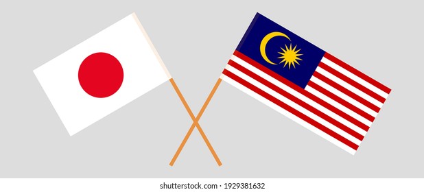 Crossed flags of Japan and Malaysia. Official colors. Correct proportion