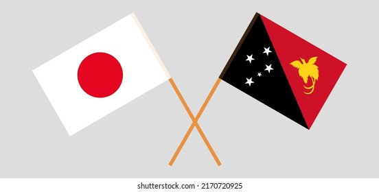 Crossed flags of Japan and Papua New Guinea. Official colors. Correct proportion. Vector illustration
