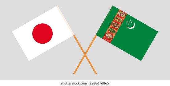 Crossed flags of Japan and Turkmenistan. Official colors. Correct proportion. Vector illustration
