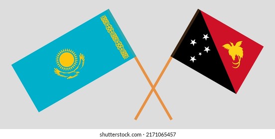 Crossed flags of Kazakhstan and Papua New Guinea. Official colors. Correct proportion. Vector illustration
