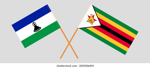 Banderas cruzadas del Reino de Lesotho y la República de Zimbabwe. Colores oficiales. Proporción correcta